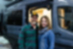 Couple taking picture in front of their new Drifter Van