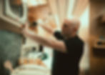 Paul Domish working on an upper cabinet inside a custom Drifter Vans campervan build